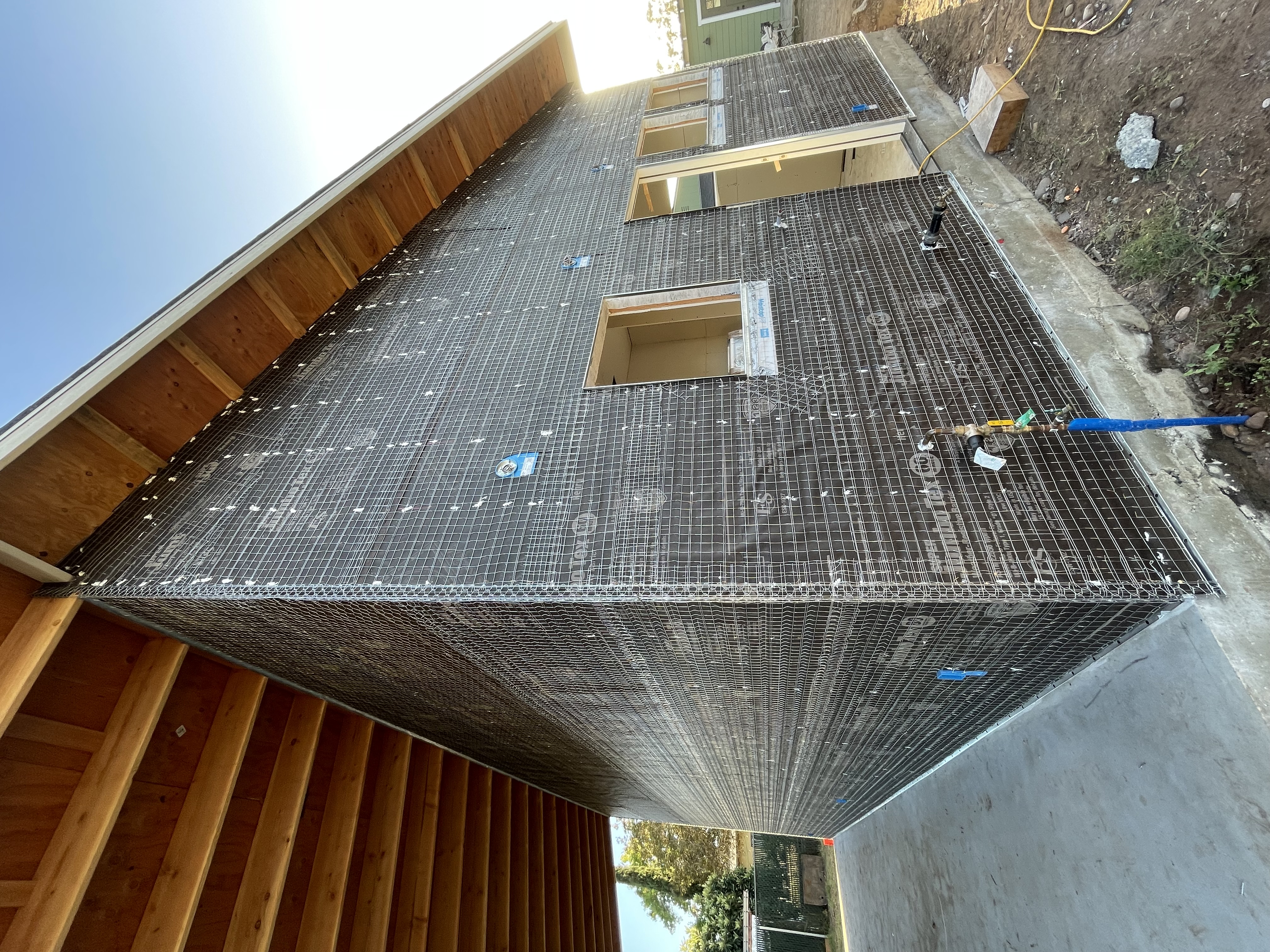 Stucco lath and exterior weather barrier installation by Arrow Construction in Escondido